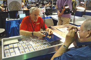 Don Ketterling is a fixture at major coin shows. Here he discusses the hot coins on the market with another coin dealer. 
